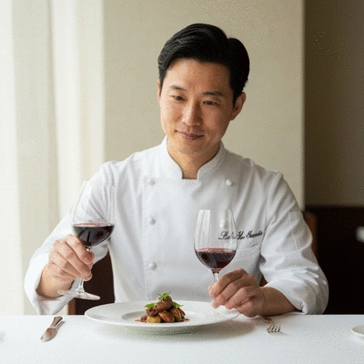 Chef presenting a perfectly paired red wine and dish
